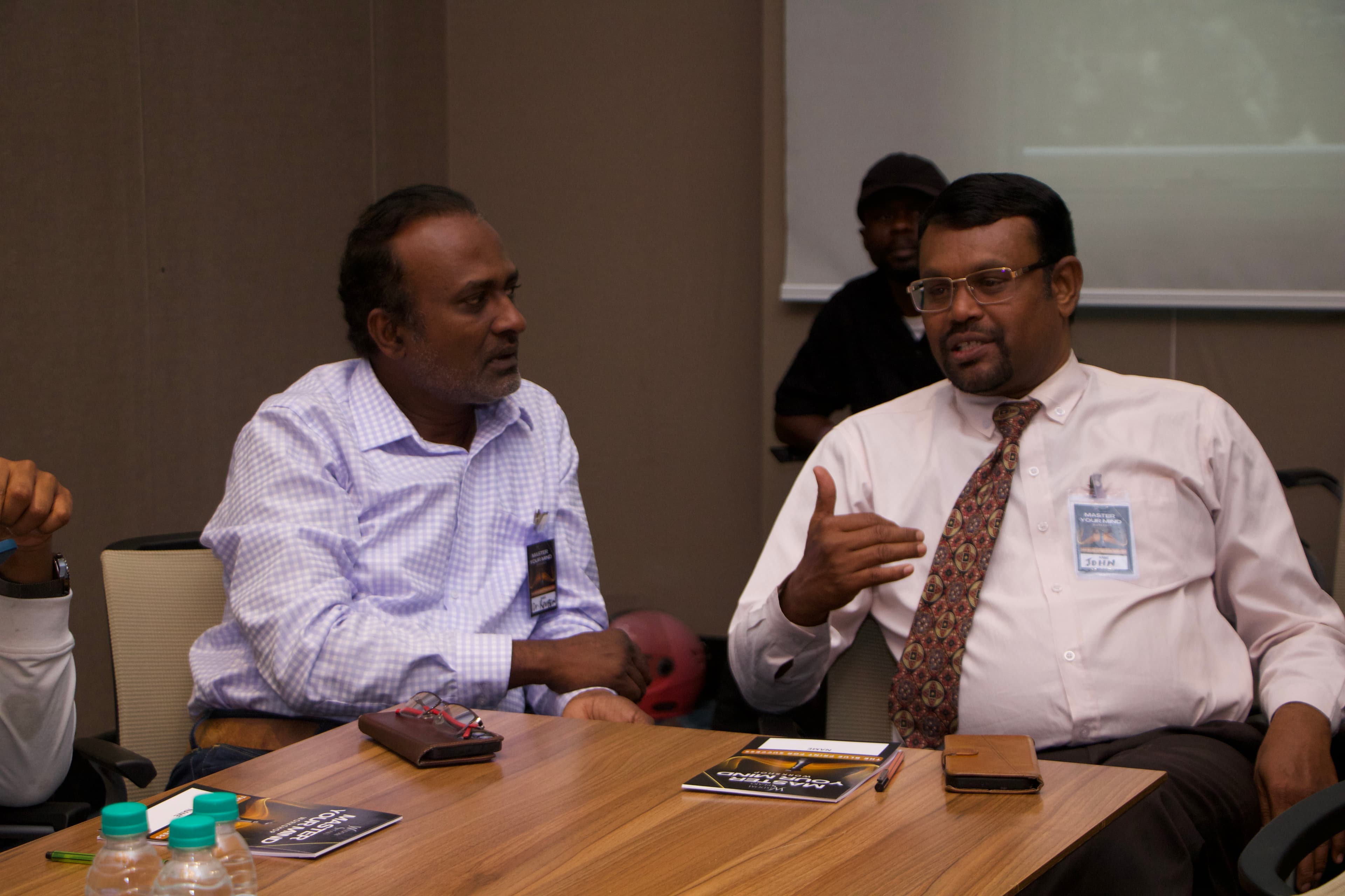 People in thoughtful discussion at a Life Speaks session